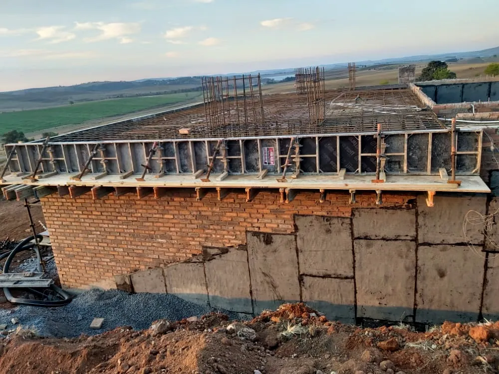 Brick and concrete retaining structure with formwork on a civil works site
