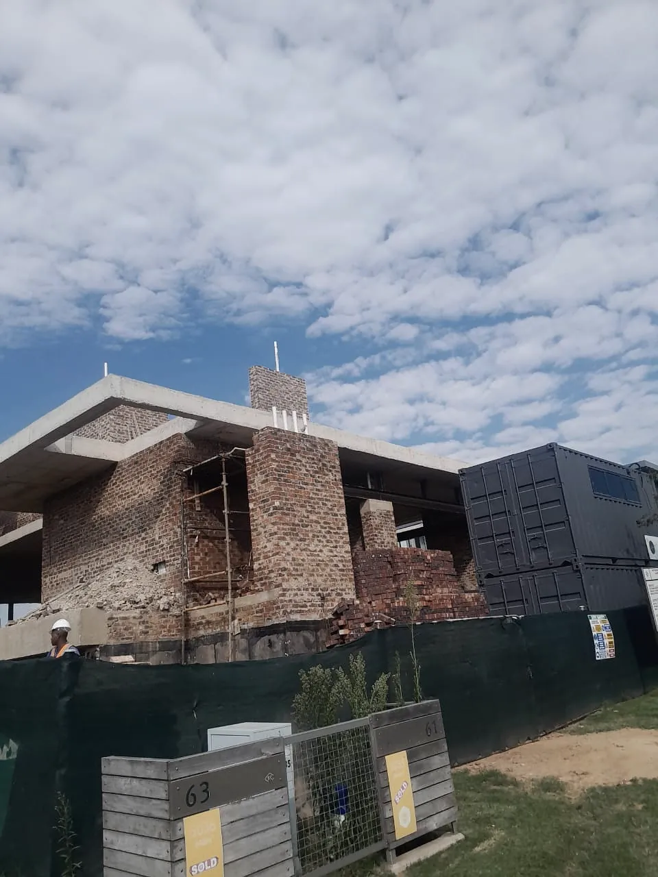 Residential house under construction in face brick with roof structure taking shape